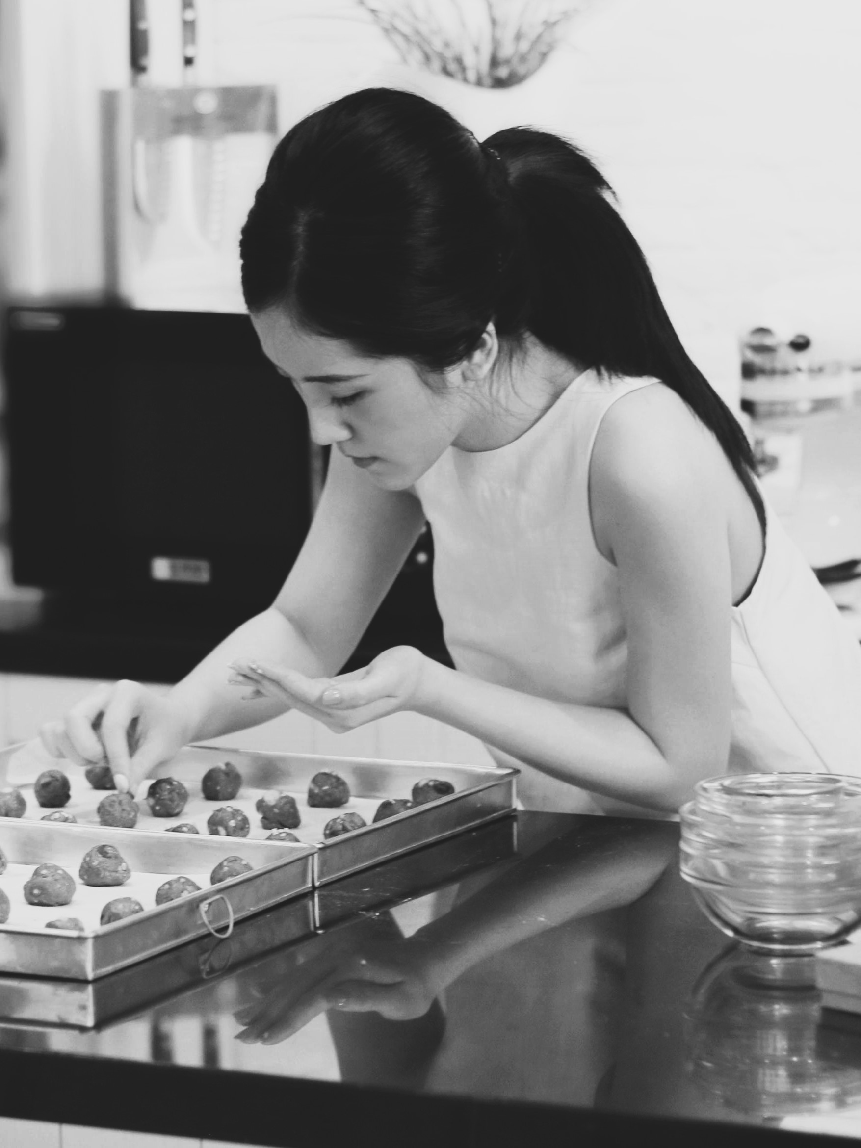 A person decorating a cake